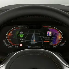 El BMW Live Cockpit Professional muestra navegación, música "Moments of summer" y asistencia al conductor.