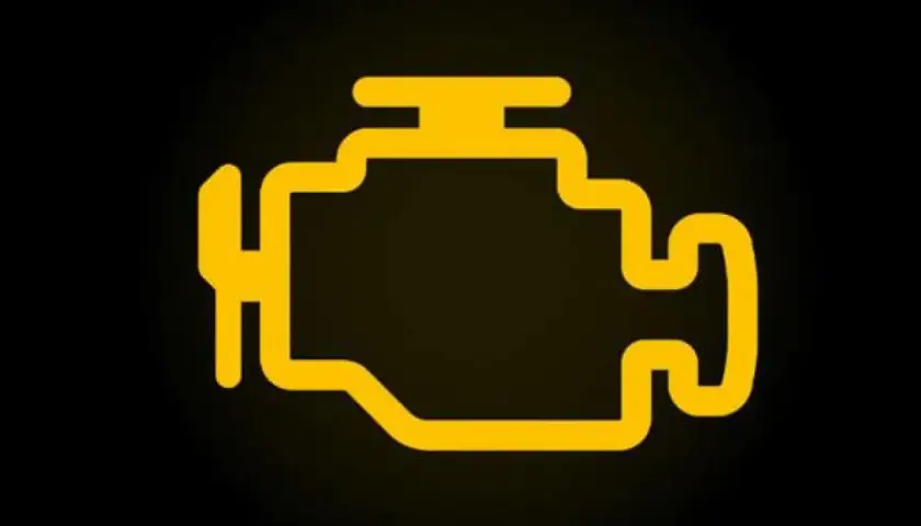 Testigo de avería motor en amarillo. Símbolo de motor encendido en el coche, indica un problema.