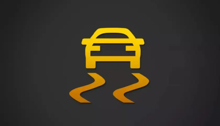 Icono de coche amarillo con líneas curvas debajo, indicando un fallo sistema esc.