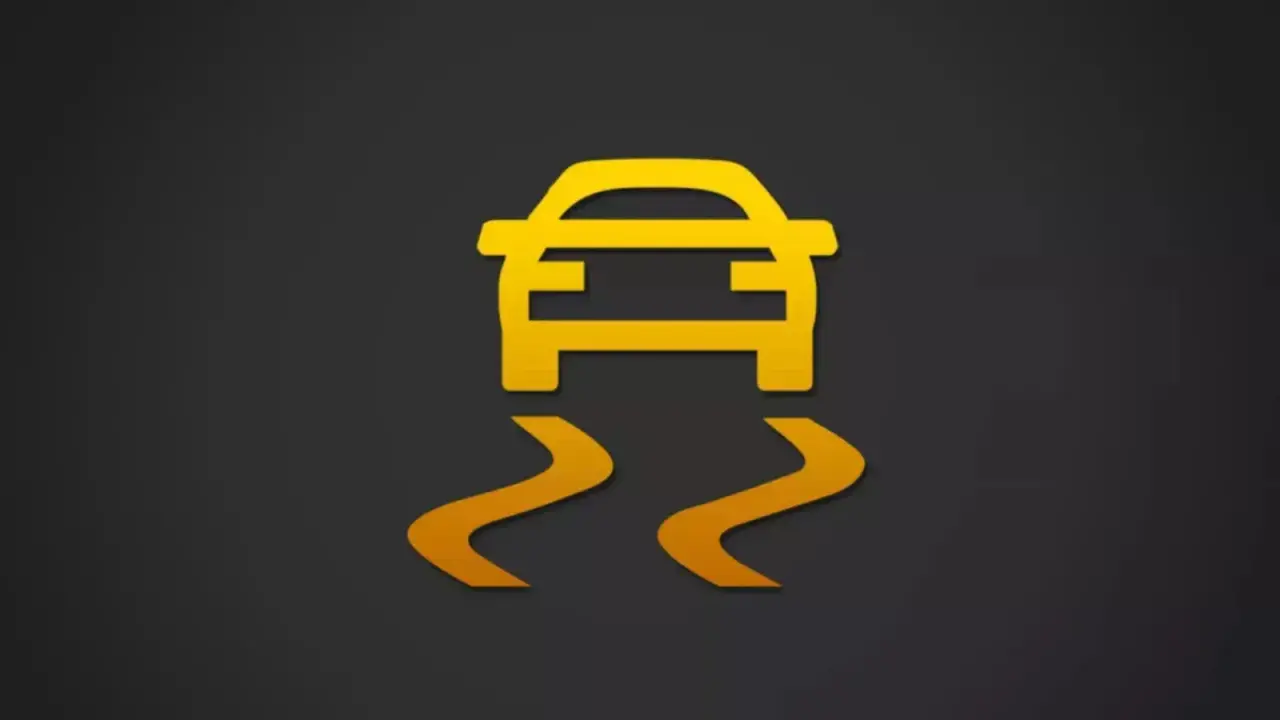 Icono de coche amarillo con líneas curvas debajo, indicando un fallo sistema esc.